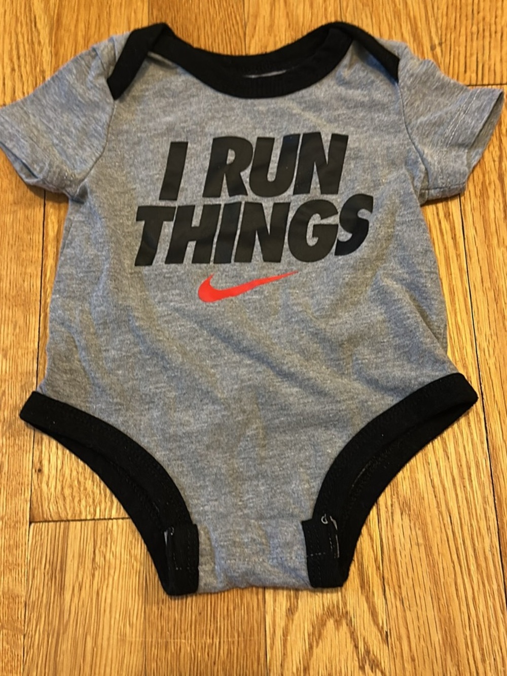 Nike Gray and Black 'I Run Things' Baby Bodysuit with Red Swoosh
